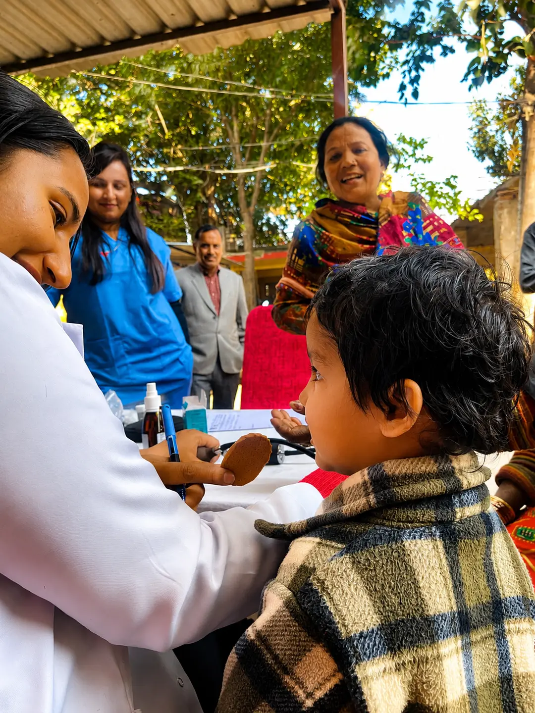 A child being examined at a rural health camp
